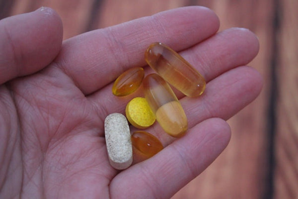 handful of vitamin supplements