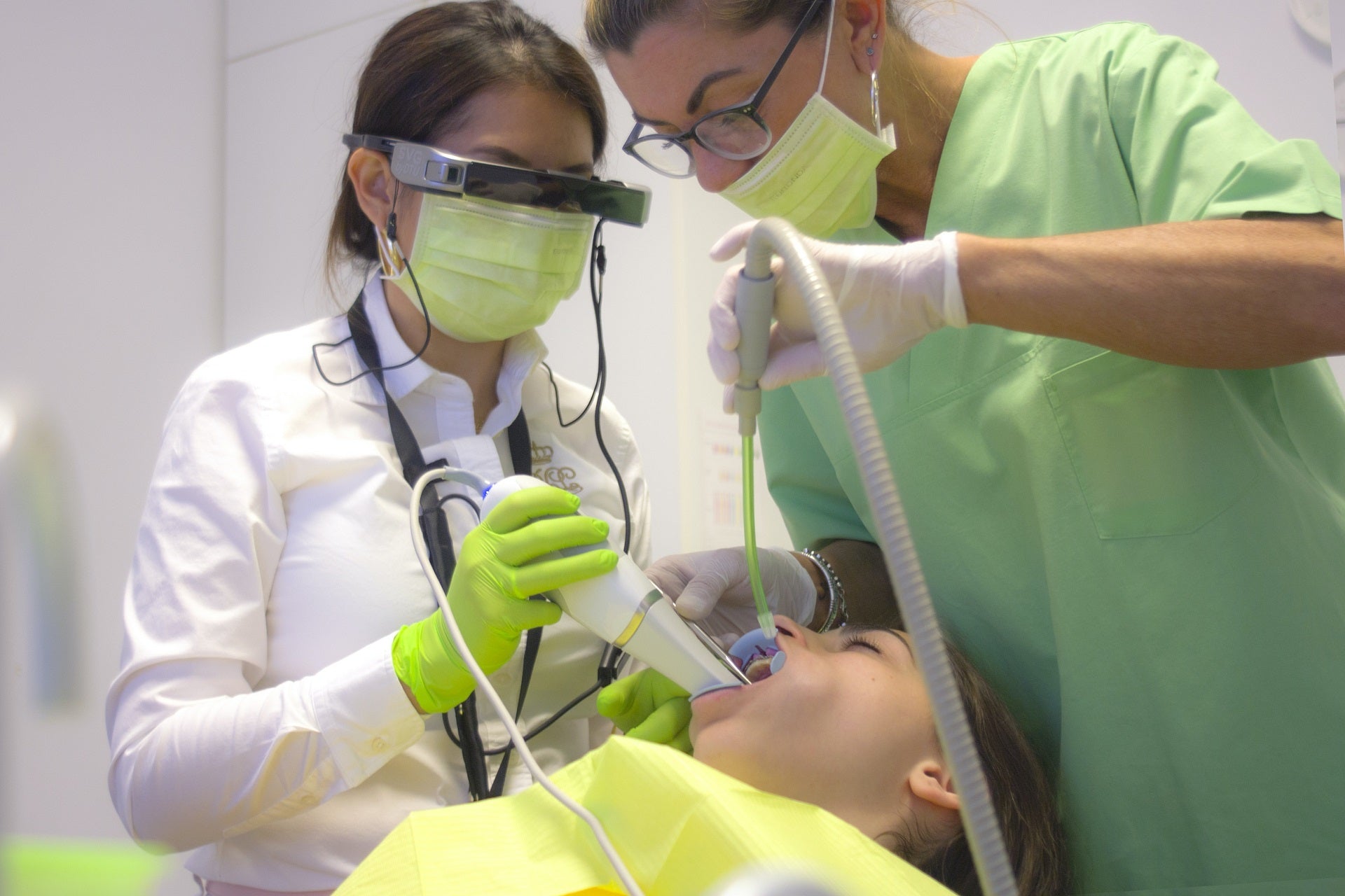 dentist and dental assistant working with patient