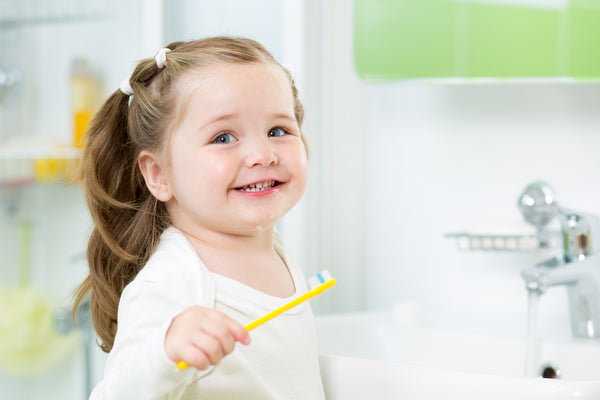 girl kid smiling after brushing teeth for oral health