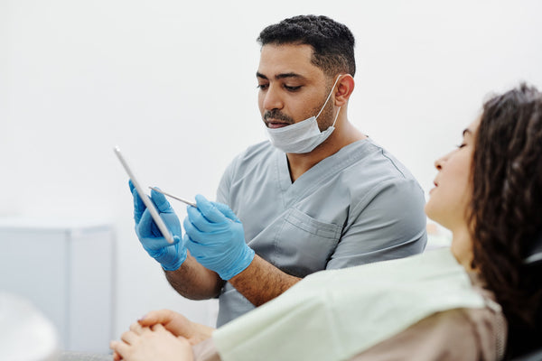 dentist discussing gum disease with patient