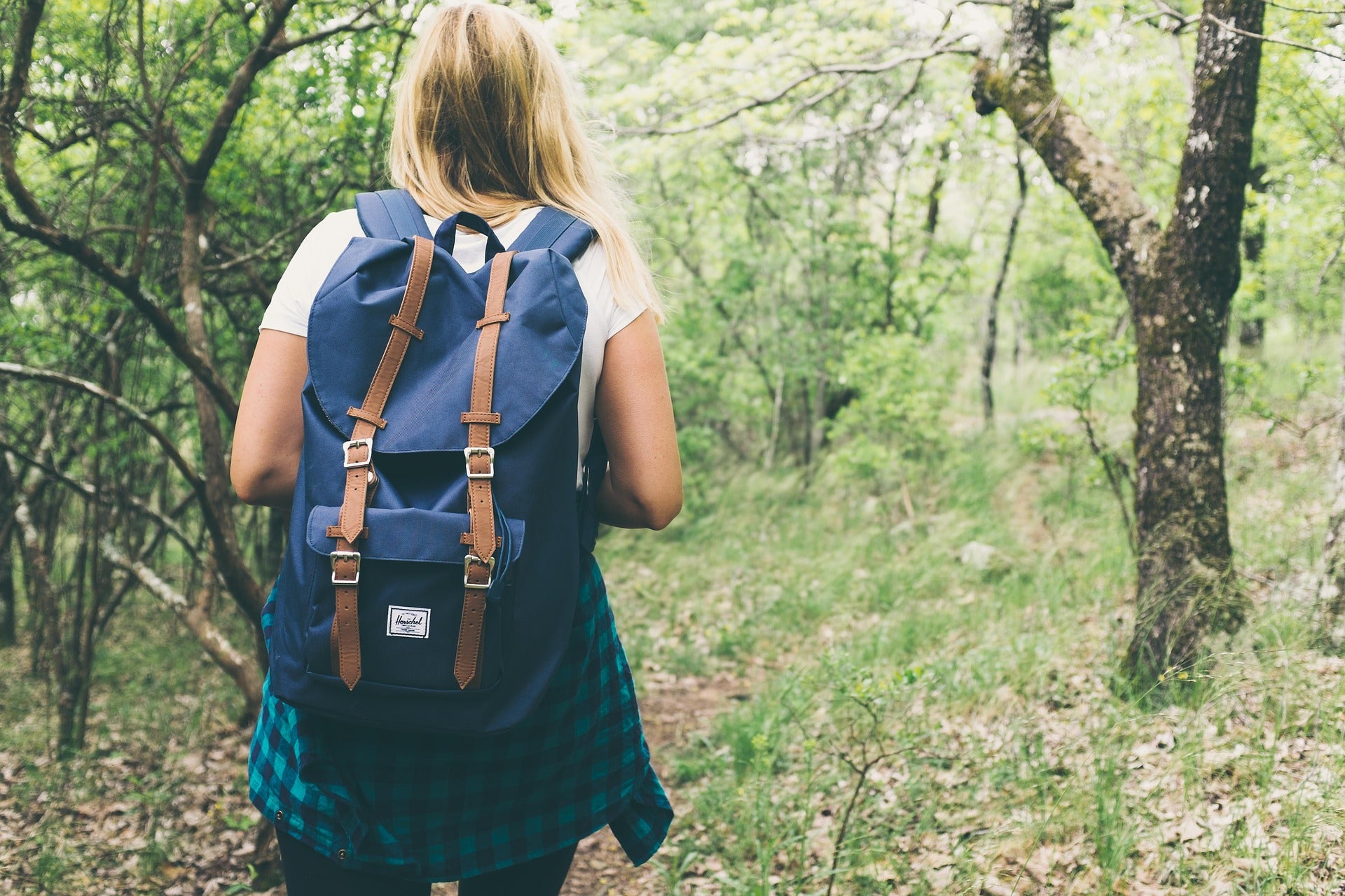 woman hiking to get healthier and happier