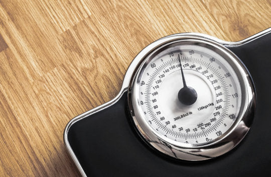 weighing scale used to check the progress of weight loss after given effective tips