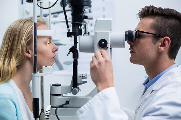 optometrist checking patient's vision