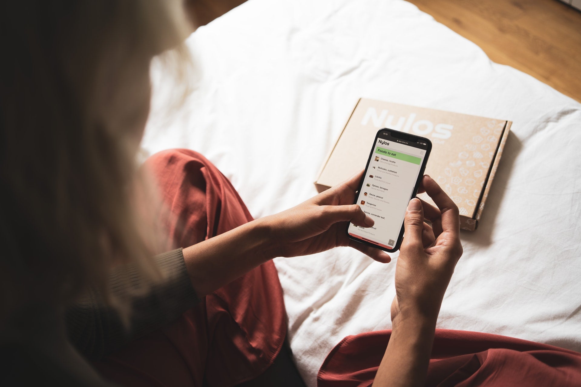 girl looking at phone before bedtime