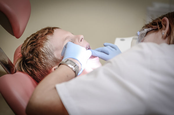 boy at dentist cavities