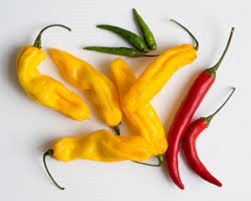 red and yellow cayenne peppers