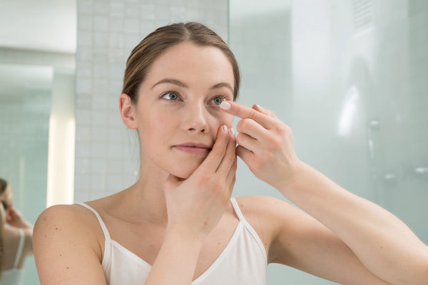 woman checking eye issues to  prevent them 