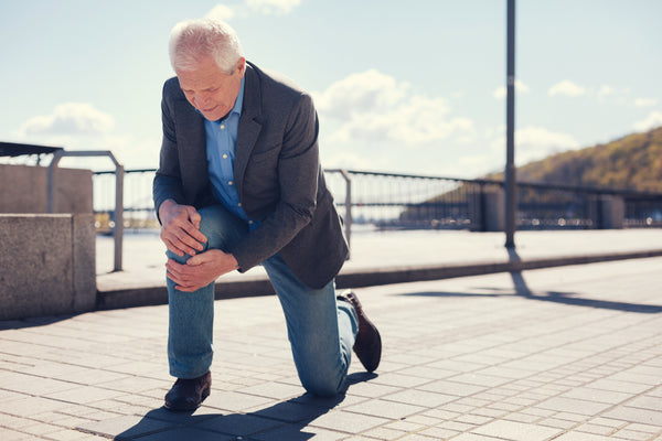 man kneeling - Important Tips For Seniors To Avoid Falling