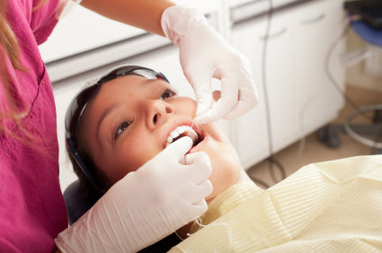 girl getting treated for gum disease