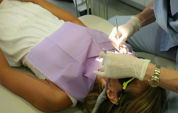 dentist working on patient's teeth