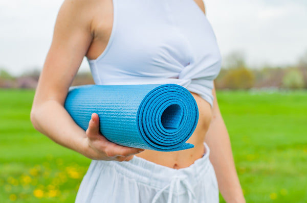 Healthy Lifestyle Tips woman with yoga mat