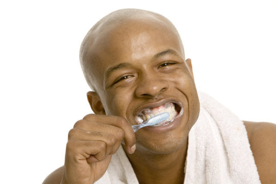 man brushing teeth