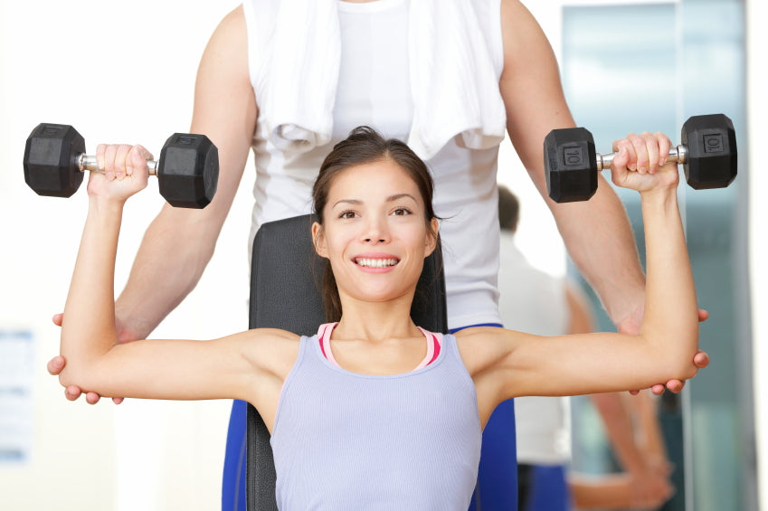 woman exercising with free weights