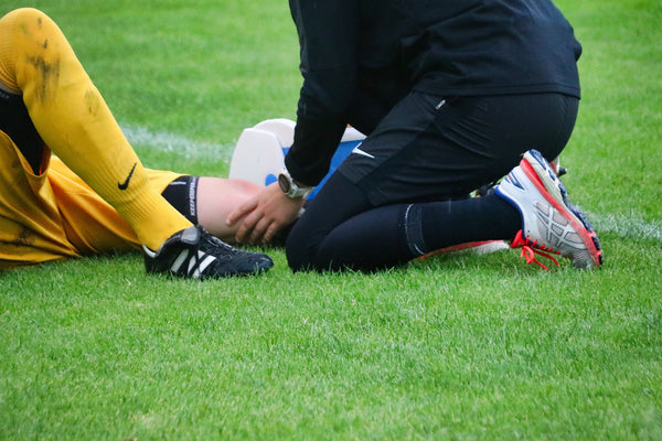 athlete on ground with sports injury