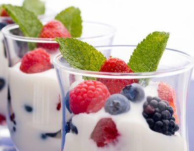 two glasses of yogurt with berries on top for back-to-school meal planning